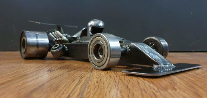 F1 car. Made form different car parts and scrapmetal. About 49 cm long - COLNIC Design